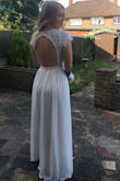 This is the 2nd dress I've brought from lulus and the quality is amazing for the price you pay!! The dress does seem a bit snug on the waist and also quite long and I will need to take it up as I'm not wearing shoes on my big day. The pattern on the back is such an eye catcher as well which makes the dress look even more stunning! - Kristina C.