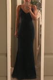 This dress is so beautiful. It runs true to size and is made of a fabric that is just thick enough to hide any flaws. It is fairly long, but with heels it is perfect! Can't wait to wear this to the black tie wedding I am attending. - Charity J.