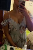This dress fits so perfect! I tried It on Braless since I'm a 34DD to see if It would fit first. Not only does It have a tight waist but It flows in the right places as well. The straps are adjustable which are a nice touch. This dress can be worn up or down! - Crisonna B.