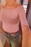 This top is stretchy. I ordered xs and s. They both fit. You can have it on the shoulder and off the shoulder. I love the material. Very soft. I bought the colours light brown and rusty rose. Both lovley! The fit is fantastic. You will not regret this purchase! - Norunn C.