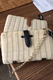 Here is the most amazing part about this purse. It has a shoulder strap. So hard to find in wicker with fresh clean lines. - Kim M.