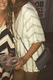 I ended up buying the medium because rompers tend to be short on me and ride up. This romper worked for my height and lower half but not necessarily for my top. The top is very loose and basically hangs open. I ended up take a small pin and closed it a bit more otherwise it would be open and even my belly button would be showing. Maybe for someone else they could pair it with a bralette but it does not lay like the model pictures show. I still thinks it's cute and enjoy the fabric just wish I didn't have to pin it every time I wear it. It also wrinkles EXTREMELY easily. - Mackenzie B.