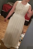 It's a beautiful dress. 3 layers to the skirt. I bought it for my pop up wedding/elopement. I wish I would have ordered a size up - there is no give in the waist! Size yourself and order accordingly.. I wish I did. With that being said, I am making it work. It cost $47 in duties to get to Ontario. Still a great price for my wedding dress. It is thick and will be nice my outdoor October wedding. I will definitely need to get it hemmed but that is to be expected. Overall I'm happy with my purchase! Thanks Lulu's - Ashley A.