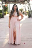 This dress is extremely well made. Three layers are used in the skirt, so if it is hot inside/outside where the event is taking place, your legs WILL be sweaty. Because I have a larger waist @ 35in, I ordered up to an XL and it still fit snug. The waist does NOT stretch, so use the size guide to determine what size to order.Unfortunately, because I am shorter and my chest is not very large, the dress ended up being waaay too long and the shoulder straps were VERY loose, so I took it to get tailored. After the adjustments were made, it was PERFECT. The dress was flowy and comfortable (minus it being hot) and the leg slit made it easy to move and dance around in. I had no side-boob action because the straps were wider, but lot's of cleavage in the front when I sat down. Overall, this dress made my night! - Angela V.