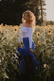 I wore this skirt to a business event at a swanky venue and then went right over and wore it to a photo shoot in a sunflower field. It was perfect in both scenarios! I love it's high/low shape that made it blow in the wind behind me. Everyone commented on how pretty it was! - Laura W.