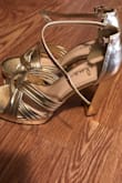 I purchased these golden heels for work (I'm a model) and I'm surprised how comfortable they are. I usually wear size 8 but I ordered size 8.5 after checking out the reviews. I would say, if you have narrow feet, there is no need to get bigger size, but if you have normal or wide feet (or your feet tend to get swollen) consider getting a little bigger size than you usually wear. Your heel will be covered by straps and the size gap won't be noticeable. This color will look good with many wardrobe options. I'm glad I bought these! - ZHANNA D.