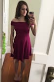 *Apologies for my dirty mirror!* This dress is beautiful - I love the color and it's really well fitted around the bust and waist. It was a little too formal for the wedding I was shopping for but I ended up liking it so much I think I'll save it for a holiday party in the future. It's hard to move your arms too much in, but that's true of any off-the-shoulder dress. In the back where the off-the-shoulder bit is supposed to fold over it sometimes pops up but that's not a huge issue. The material seems nice and sturdy and quite flattering. - Laura B.