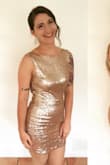 The dress is a little tight in the midsection, but fits great everywhere else! The dress is on the shorter side. Definitely wear a sticky bra or pasties because it slightly outlines your nipples if you do go commando! I received so many compliments on it and can't wait to wear it again! - Bonnie C.