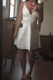 Bought this dress to wear to my bachelorette party, it is super flattering. Very nice material, when it comes in the packaging it is a bit wrinkled so just make sure to steam it or have it dry cleaned before wearing! - MEGAN F.