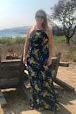 Gorgeous dress that was perfect for a summer wedding I attended. The straps in the back are difficult to figure out the first time but once you get it right, it is so beautiful!  I couldn't figure out what bra to wear as if it backless and I am large chested. After a couple hours, the straps in the back did become uncomfortable and had to be adjusted. It will be long on anyone's shorter than 5'7" as I was barely able to wear flats. - Ariana R.
