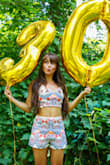 I ended up ordering an XL because I really wanted this whole outfit for my 30th Birthday and some parties coming up! I got the shorts in a small which fit great but they were out of stock in the top and only had XL left. I was afraid I wouldn't ever get it so I asked my seamstress if she could make it fit and she did! Turned out great! Absolutely love this look! - Samantha T.