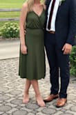 I wore this dress to a wedding and absolutely loved it! I got quite a few compliments on the slit and how cute the color is. The material was very breathable and hugs your curves nicely. My only complaint was that I needed to pin the top since it was loose. Overall, I'm extremely happy with this dress and can't wait to wear it again. - Megan S.