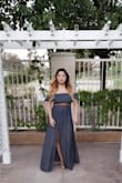 This dress fit comfortably all the way down. The slit was at the perfect height on the thigh, careful at not showing too much. I am heavy on top, but went without a bra and you couldn't tell at all. The dress is super long though, so I had to take a couple inches off. I paired it with a brown belt and brown wedges. I got TONS of compliments on this look all night. - Pawnie S.