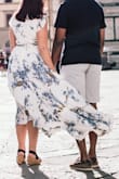 Wore this dress for my wedding party welcome party and for honeymoon photos. The high-low makes this dress pretty good for petites. I am 5' 1" and wore with 2.75 in wedges and it only dragged a little. My complaint is with the top being too big, even for my 32DD chest. I pinned it because it shows a huge amount of cleavage. I also have small shoulders and it seemed a bit big in the shoulders as well (I had to have another LuLus dress altered in the shoulders to fit so I do not think that they are made for petite torsos) so not sure that going down in size would help. If only they would make dresses that fit better for petites - Kerry D.