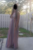 Love the dress. Shows a bit too much cleavage. Very thin material but comfortable to wear. Also, the strings are a pain the butt. I wore it halter top style and tied the back strings up behind my neck. The waist/under bust is very stretchy and does not lay flat like shown in the picture. - Amy M.