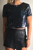 I cut the ruffle part of the sleeves off of this top and fell in love with it. It's somewhat heavy material so you may sweat a bit in it if it's warm where you're going. - Kelly L.