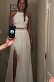 This dress was perfect - exactly what I was looking for: two piece, high slit, high neck. 
I definitely needed an xs but the small would work with some alterations. 
You could wear a strapless bra with it & tie the back straps all the way up & not see the bra strap at all. Not see through either. 
I decided to go with a different dress for my intimate wedding but really do love this. I may order in black to wear for my bridal party! - Mariah M.