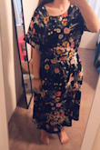 When looking at the size chart, I was in-between sizes small and medium. I went for the medium, knowing that many clothes from Lulus tend to run a little small (juniors sizing). The medium fit me perfectly in the waist (the small would have been too tight) but was slightly larger than expected in the back, where it zips up. This causes the neckline to move around a bit on me, and I wish it were a little tighter, but I couldn't compromise on the waist sizing. I'm still planning on keeping the dress, if anything I can see if a seamstress can do something to make the top half less baggy. Otherwise, this dress looks fantastic, it's flattering and modest without looking "frumpy." It appears well-made, not cheap. A fair deal for the price. The bottom half is lined, which adds some weight and may make it a little bulky for summer weather, but it'll be nice for transitioning into fall and winter! - Valerie B.