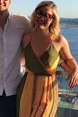 I really wanted the jumpsuit in the photo, and mine is close, but the whole front is practically green, and I thought it would be more yellow/orange/pink. Still cute. Very long, had altered. - Alicia C.