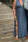 This dress is not only a beautiful color but so versatile for many body types. You can rest assure that when purchasing that you can work the dress to show as much or as little skin as you want. There is plenty of fabric to personalize the top and adjust as needed. I bought the XL in slate blue. I'm 5'8" and wore flat shoes and did not need the dress hemmed. I did have a slit added (pictured) - Annalise R.