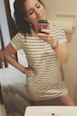 I really love this dress! It fits exactly like I hoped it would. Makes me feel casual and a little skater girl-ish, but still sexy. Goes super well with cute sneakers or sandals. It's definitely on the shorter side, which I like, but if you're super tall it may be too short. The material is thicker than I expected, but that's ok: it makes it feel like it's a higher quality, and durable. The white comes with a lining so that it's not see-through. I love this dress so much I may buy it in the navy also. I heard the navy doesn't come with a lining, so it may also be lighter and more summer-y. Couldn't recommend this highly enough! - Amelia F.