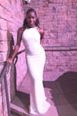 The dress was super pretty and it fit amazingly. I did have to wear 6inch heels because she the dress was long. I received so many complements. I definitely recommend this dress. - STARR J.
