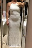 I purchased this dress for an intimate, at home, ceremony. I couldn't go wrong with a price tag of $55 (now even cheaper)! Even though it was a final sale with no return...$55 for a wedding dress was completely worth the risk. I'll have tummy work to do to loose the pooch but the dress fits very well and is comfortable as well as soft. The dress looks exactly as advertised. I went to a wedding boutique recently and tried on dresses galore and they were so uncomfortable and itchy! Satisfied with my purchase and with the right accessories this dress will be perfect! I apologize for the lighting in my pic. The photo does not do it justice. - Bridget C.