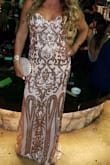 This is dress is absolutely GORGEOUS and it fit me like a glove. The sizes do run small. I ordered an L and I am normally a M and the dress fit perfectly on me. Had I put on weight I would not be able to fit in it.
I was absolutely happy with the dress and I received so many compliments. I wore it to my cousins wedding and I can not wait to wear it again.
Only down side is that the beads/sequins tend to get VERY SCRATCHY and the inside of my arms was sore by the end of the night but definitely worth the pain. - Pascale T.