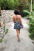 I bought this romper for my honeymoon in Italy. Got so many compliments! It fits true to size. - Maira M.