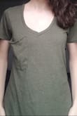 You can't really tell in the preview photos, but there's a breast pocket that is super droopy and baggy and will not lie flat. It looks like I have droopy cleavage or something; not very flattering! I think on a larger chested girl it might fill out better. The shirt is really comfy and soft, but I will be returning it. - Chiara E.
