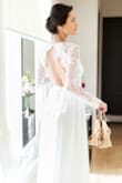 This was my wedding dress and we absolutely loved it! Lace sleeves and the open back is soo romantic! - Niloofar D.