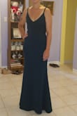 I purchased this dress in a medium for a wedding I will be attending. I originally wanted to go with a small, but they were out of stock, so I went with a medium. It fit everywhere but my bust area. It was a little loose, but I needed to get the dress altered anyway for the length, so I decided to keep the dress and alter the length and bust area. The dress fits well now. It is good quality, both thick and stretchy material. The full body photo is after alterations and the second photo shows how it fit a little loosely in the chest area. - Tzila B.