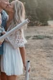 Wore this for our gender reveal, it looked so great in the photos and I couldn't be happier! I'm tall and ordered the Large and it fit great, maybe an inch or too short but it was okay! I didn't even wear a bra and it looked awesome! - Nancy G.