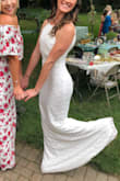 Wore this for my bridal shower and received tons of compliments! This dress will hug your every curve. It was too long for me and did snag quite a bit because the material is so soft. And since it was too long it did start to collect anything on the ground... like twigs, grass, leaves etc. But all in all this was the perfect one timer of a dress!! - Chanelle T.