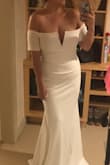 I bought this dress to be a white bridesmaids dress for my best friends wedding and I am absolutely in love. I will need the drop sleeve taken in a bit and a few inches hemmed from the bottom but that was to be expected because I have a large chest. The material is thick and a little stretchy, photographs so well! Love it! - Brooke Y.