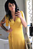 I bought this dress for my best friend's wedding in Sweden. The color is great, the material is perfect for hot weather, but, I did have to safety pin the leg slit a bit. I wore slip shorts, but I had to do a lot of running around to help with the wedding. Just the pin holes from the safety pin tore the fabric super easily. Just an FYI if you'd like to alter the slit in the dress. - Heather N.