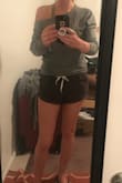 This is probably the best thing I've ever purchased from Lulus. I got a small and it fits exactly like the photo. I'm on the wait list for the white one in medium because I want to try a slouchier fit but the small fits great too. I love it. Kind of expensive for one shirt but worth it in my opinion. If your on the fence buy it. You'll love it! - Destiny H.
