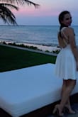 This dress is perfect. I have bigger hips and it fit perfectly. The open back looks great and the dress is the perfect length and not too short. Looks super classy! - Ann L.