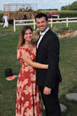 The dress has nice flowy material. It fits great, and I didn't even have to hem it to wear it with heels. With flats it is a little long on me, but it still works (I'm fairly short). Wore this dress to a barnyard wedding and it was perfect!! - Catalina C.