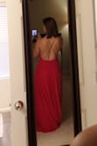 I bought this dress for engagement pictures and am so pleased! It is very flattery and flowy (but still full at the bottom). The material is also slightly stretchy so I didn't have to worry about it clingy too much and showing off cellulite! Haha. A true red color (the website pic seems a little orangish but happy to see it's a true red). - Erica R.