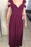 It's a good quality material and it fits perfectly if you follow the measure instructions. The color is something in between dark red and purple. Amazing! - Jessie A.