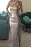 This dress fits gorgeously. It is a little long - in 3 inch heels it just touches the floor. The sequins do fall off but that doesn't affect the look of the dress. I think the material looks a little bit cheap up close but overall it's low price for a beautiful gown. - Shannon H.