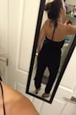 I originally ordered the large because I have a hard time with jumpsuits as I have a small top and large hips. However, I ordered the medium as well because the fabric has some give and the medium fit perfectly! I love that I can dress this jumpsuit up or down. I feel sexy and sleek, as I find this to be extremely flattering. I found that I have to tie the strings a little tight to compensate for the front and it's a little snug in the armpit, but it still is comfy! - Lauren C.