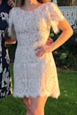 Wore this for my wedding rehearsal and dinner. It's fitted in the waist to give you shape and loose everywhere else. I was comfortable outside in the sun and got tons of compliments! - Kristine N.