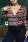 When I opened the package I thought this sweater would be super tiny on me also I was worried about the stripes and curvy girls everywhere know what I mean.
 The fabric is fairly stretchable but a little itchy. It's definitely gonna keep you warm in cooler temperatures. You definitely need a super high waste pant with this top because if not it would be a crop top sweater which is pointless. I love the color though and def recommend it for a cute fall outfit! - Katherine N.