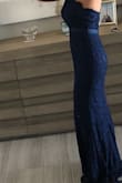 This dress is beautiful. It's heavy weight and looks expensive. It's a little bigger than it's size but otherwise perfect. - Loan T.