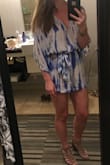 I was a little nervous purchasing this under final clearance with mixed reviews from other ladies at my height. I bought the large thinking if it didn't fit super well I'd just use it as a swim cover-up. I absolutely ADORE this romper. The gauzy fabric is light but gorgeous. I paired it with a thin long necklace, wavy hair, and taupe strappy wedges for a night out in Vegas and felt amazing in it. I'd definitely stick with the large to fit my height but it does fit looser in the body than on the model at that size. I have a smaller chest and booty and loved the fit. Definitely room for someone with a larger chest but ladies with more on the bottom may have a little cheek showing. - Devin W.
