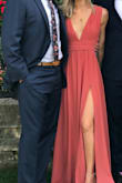 Loved this dress and got a ton of compliments on it at the wedding. It is slightly heavy as the bottom has three layers of fabric but it was manageable. It fits true to size and is pretty long. I had to wear heels and it still hit the floor. I would have liked to have ordered an XS instead if it was in stock, but the Small did it's job. Overall It was perfect. - Sommer T.