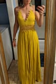 This dress fits like glove.  I was worried that the color would be a darker mustard but it is a light yellowish mustard. - Maria A.