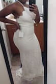 This dress fit so well! Since the straps adjust I won't need to get the top altered but I will definitely have to get the bottom hemmed. I was so excited when I tried this dress on. It really accentuates your curves. The color is cream so it is pretty dark but like others said, in pictures it looks white so it doesn't bother me. I can't wait to wear this for my courthouse wedding in April! I will only add a bridal belt for extra detail. - Precious S.
